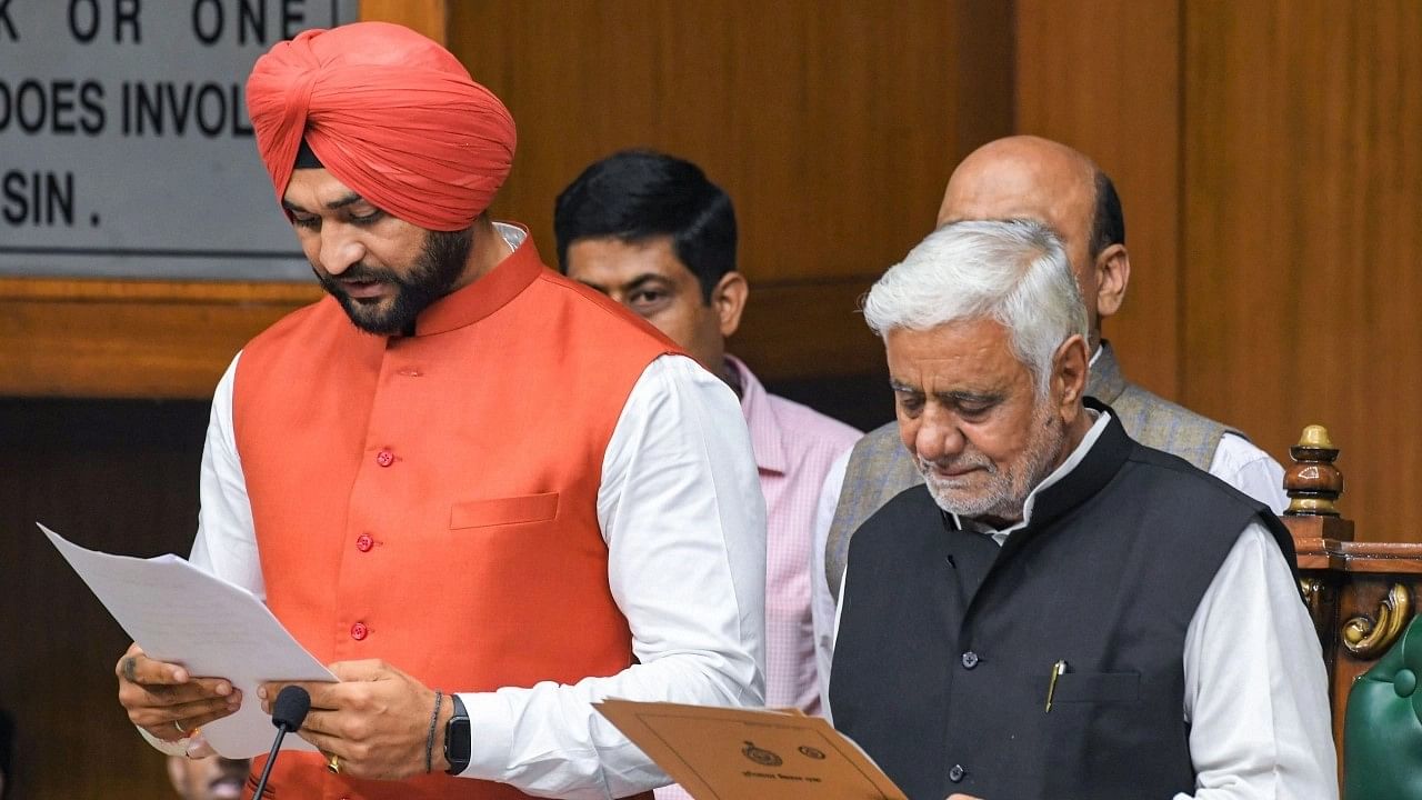 <div class="paragraphs"><p>BJP MLA Sandeep Singh (left) being administered the oath at the Vidhan Sabha in Chandigarh on 4 November&nbsp;2019.</p></div>