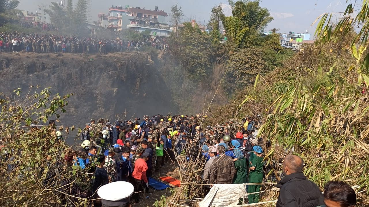 <div class="paragraphs"><p>Rescuers recover dead bodies of passengers from the aircraft crash.</p></div>