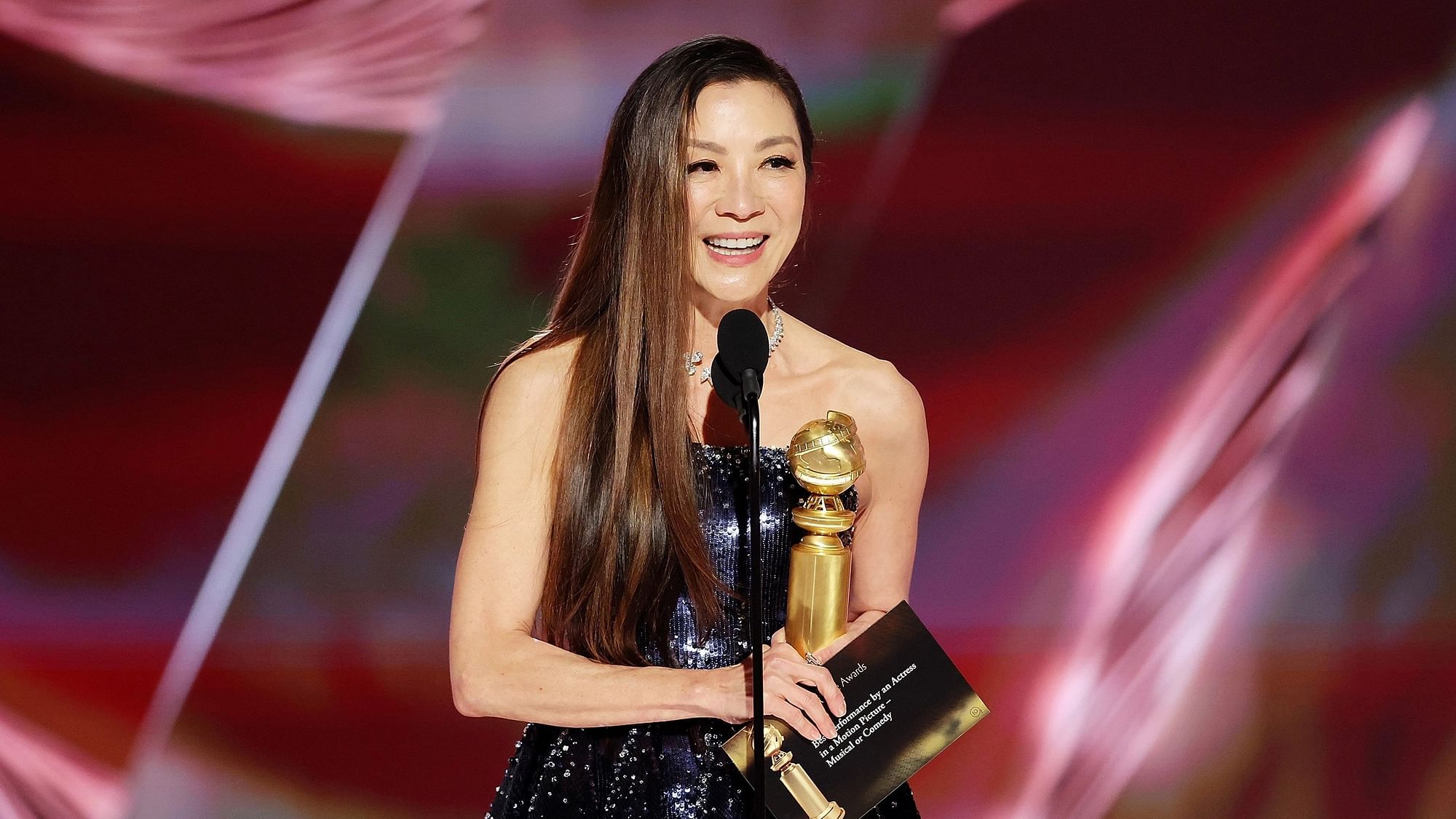 <div class="paragraphs"><p>Actor Michelle Yeoh holding her first Golden Globe.</p></div>