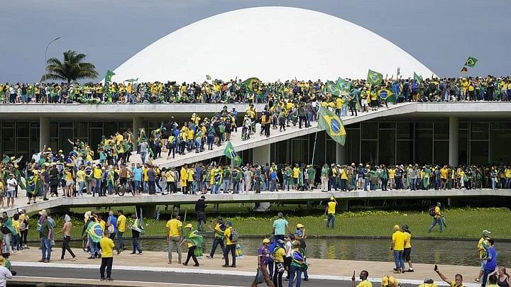 <div class="paragraphs"><p>Protesters, supporters of Brazils former President Jair Bolsonaro, storm the the National Congress building in Brasilia, Brazil<br></p></div>