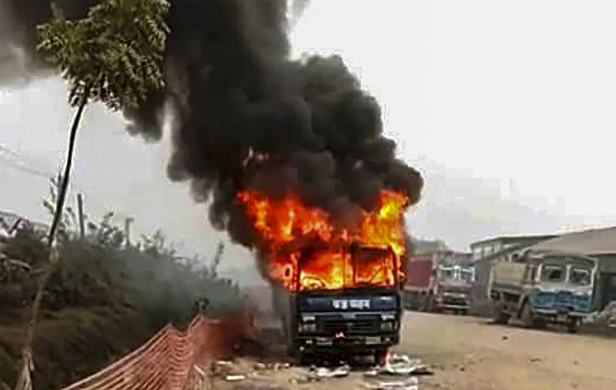 After a violent crackdown on protesting farmers in the middle of the night, the farmers set a police van on fire.