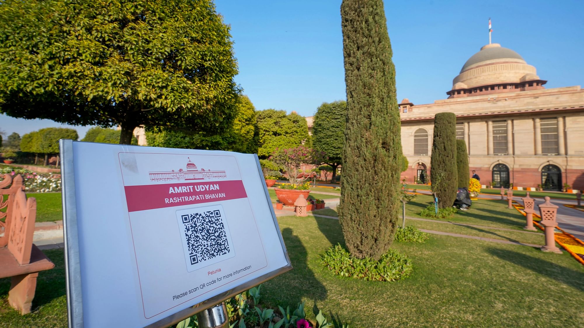 <div class="paragraphs"><p>A signboard with a QR code having information about the flower species mentioned below the code at Amrit Udyan on the premises of the Rashtrapati Bhavan, during media preview of Udyan Utsav, in New Delhi, Saturday, 28 January.</p></div>