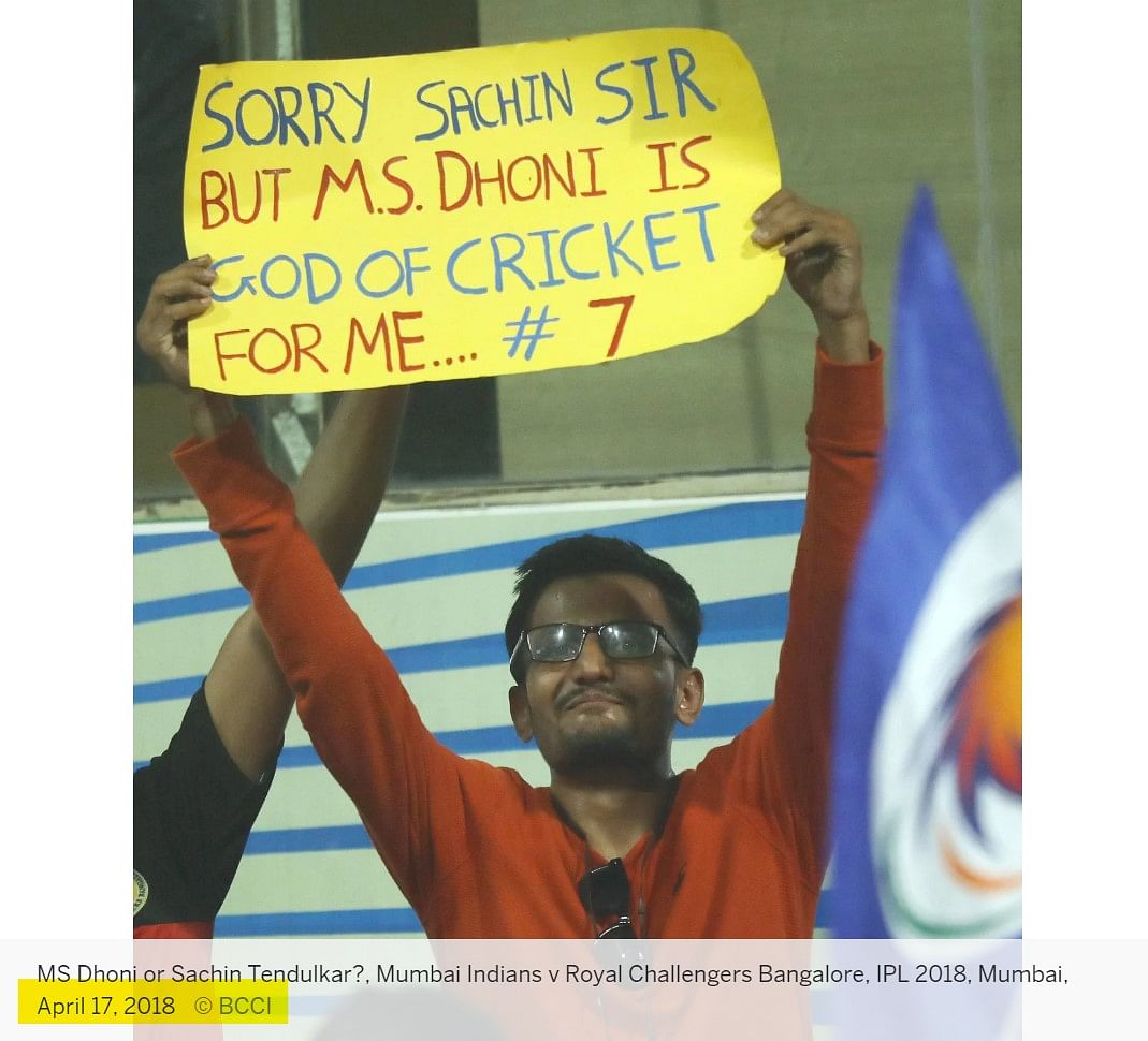 The original placard mentions Sachin Tendulkar and Mahendra Singh Dhoni's names. 