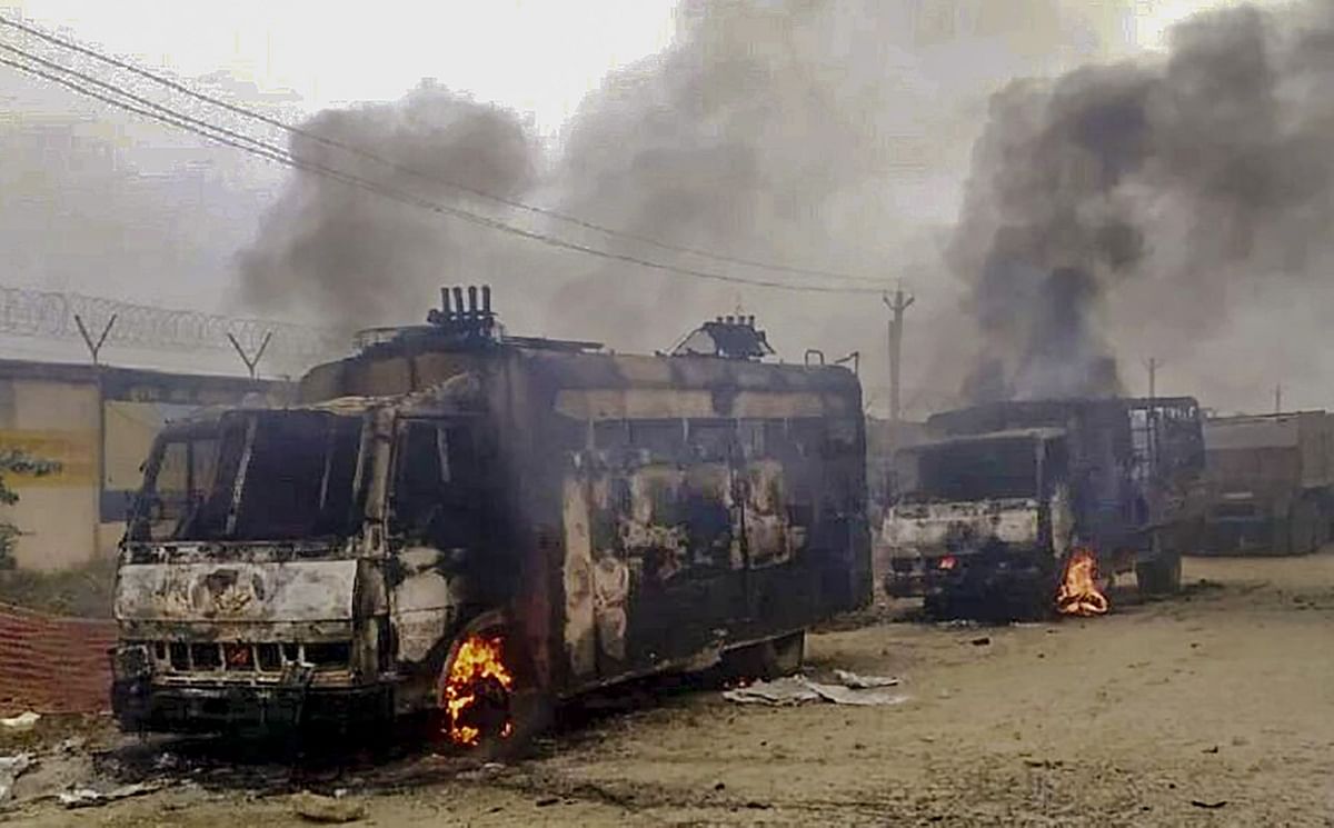 After a violent crackdown on protesting farmers in the middle of the night, the farmers set a police van on fire.
