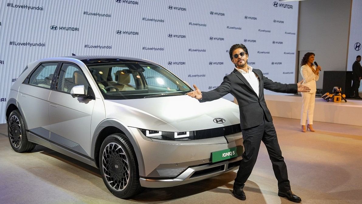 <div class="paragraphs"><p>Greater Noida: Bollywood actor Shah Rukh Khan poses next to Hyundais all-electric SUV IONIQ 5 during its launch at the Auto Expo 2023.&nbsp;</p></div>