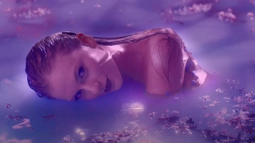 <div class="paragraphs"><p>A still from Taylor Swift's song lavender Haze.</p></div>