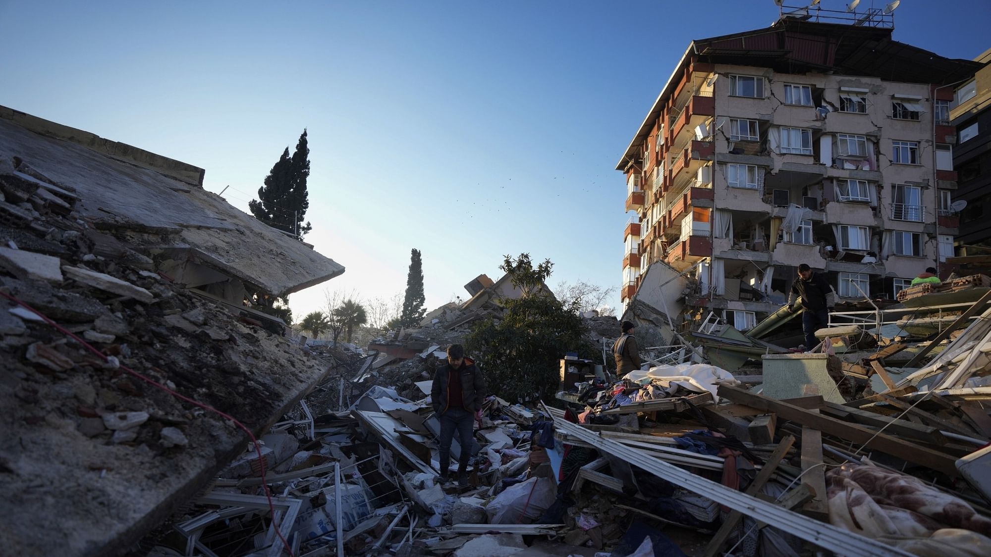 <div class="paragraphs"><p>A man walks through the rubble of destroyed buildings in Antakya, southern Turkey.&nbsp;</p></div>