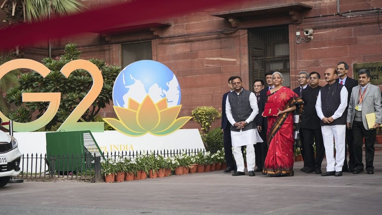 <div class="paragraphs"><p>New Delhi: Union Finance Minister Nirmala Sitharaman with Ministers of State Bhagwat Kishanrao Karad and Pankaj Chaudhary and officials poses for photographs outside the Finance Ministry at North Block.</p></div>
