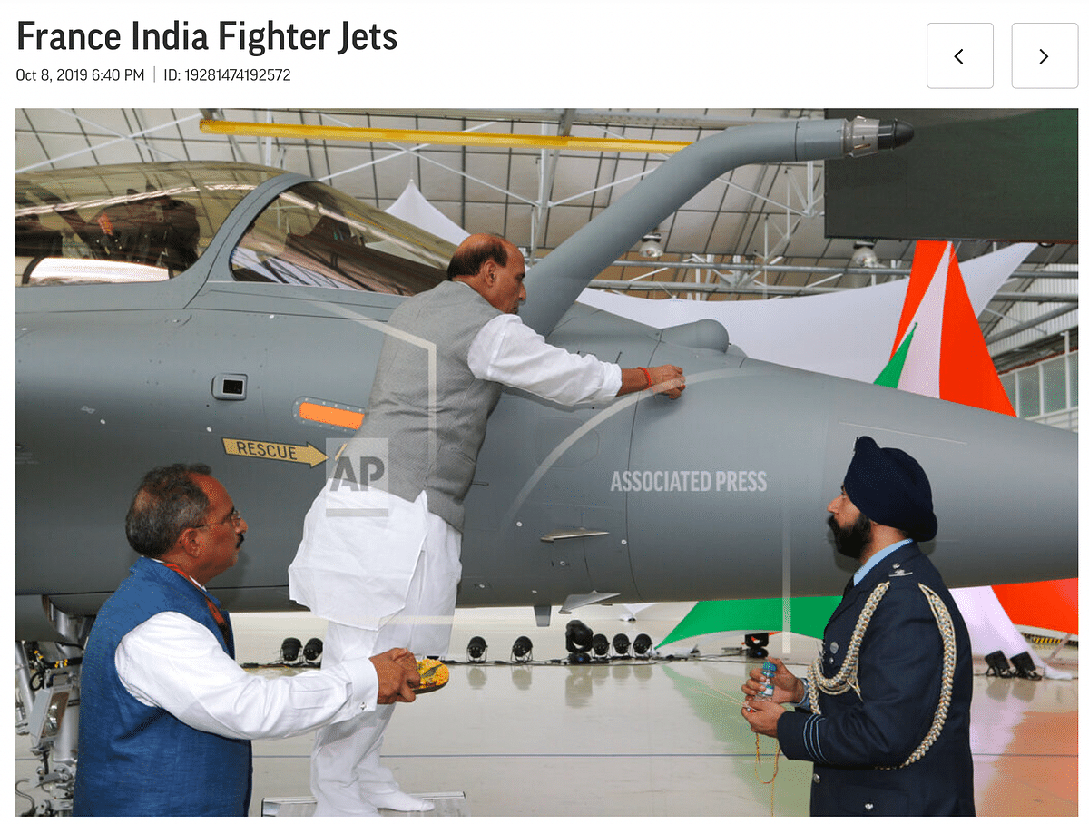 The original photo shows Defence Minister Rajnath Singh observing a ritual during a handover of the Rafale jets.