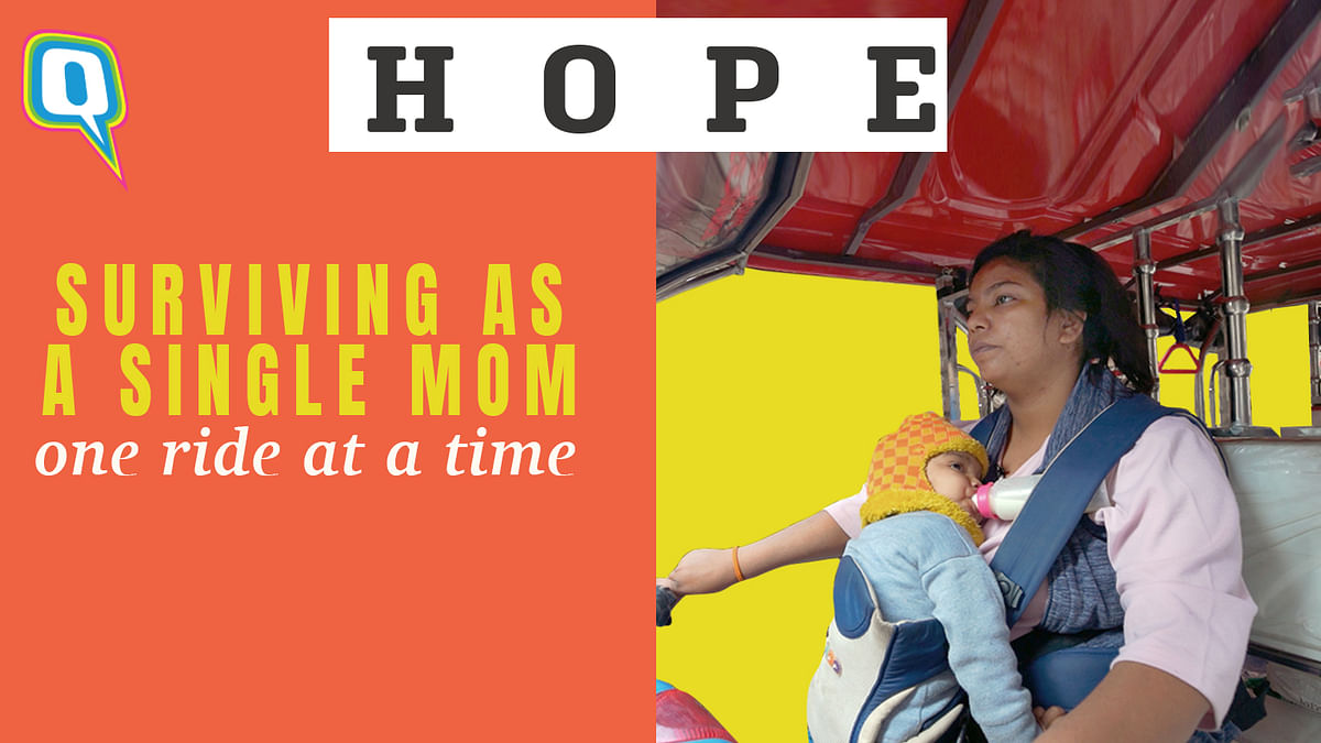 Single Mom Drives an E-Rickshaw With Her Son Strapped To Her Chest