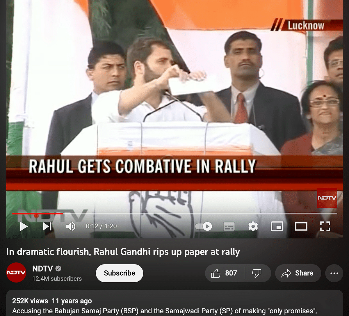 The image is from 2012 and shows Rahul Gandhi tearing up a piece of paper with poll promises made by SP and BSP.