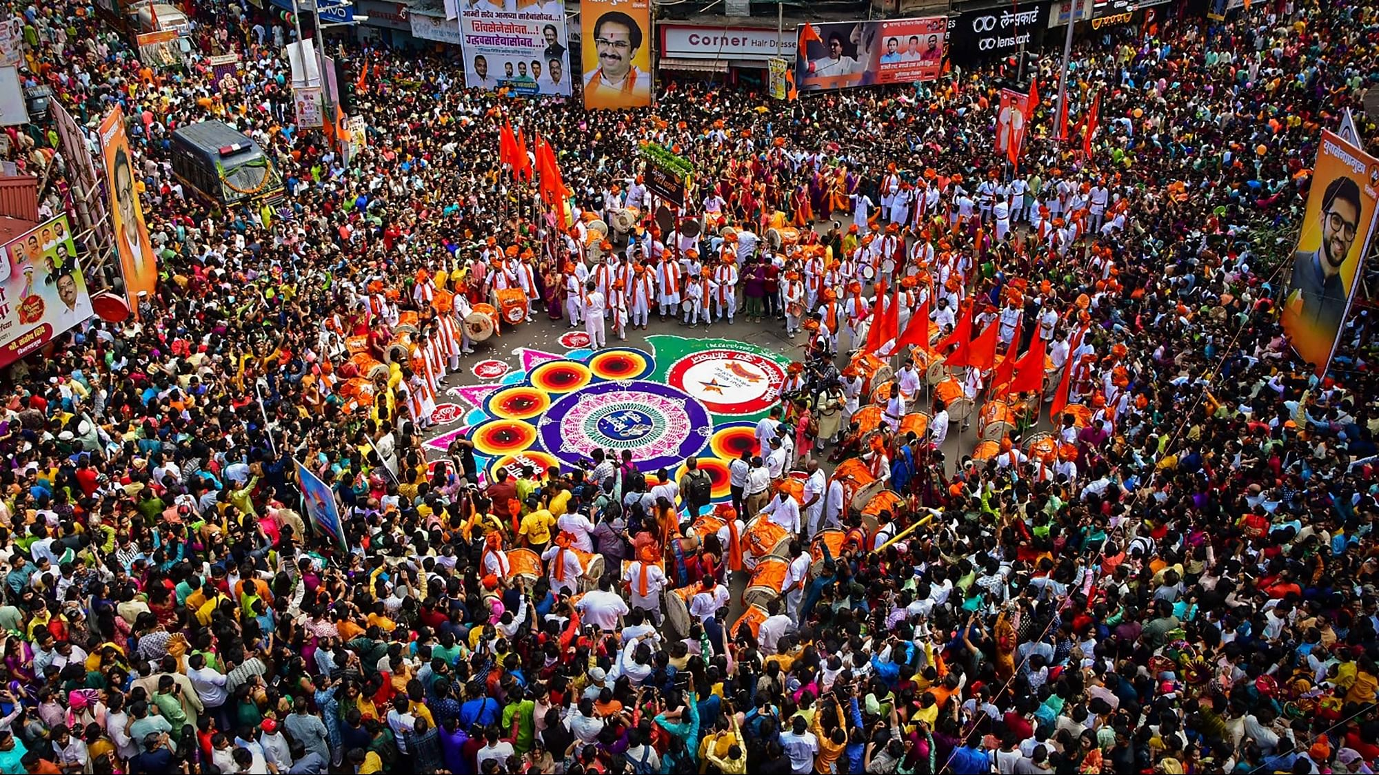 <div class="paragraphs"><p>People gather to celebrate the Marathi New Year, Gudi Padwa, at Girgaon in Mumbai, on Wednesday, 22 March.</p></div>
