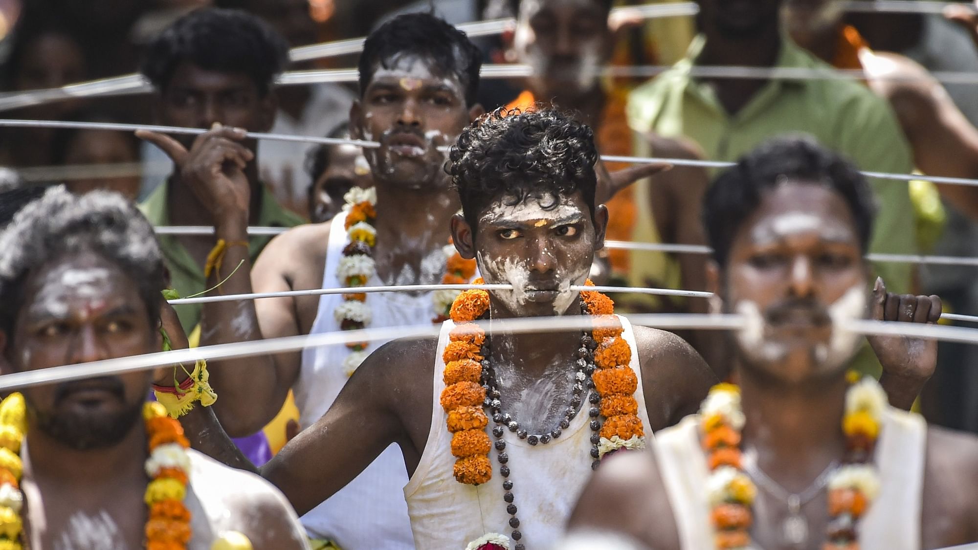 <div class="paragraphs"><p>Tamil Hindu devotees with their bodies pierced take part in a religious procession to mark the Panguni Uthiram festival, in New Delhi, on Wednesday, 5 April.</p></div>