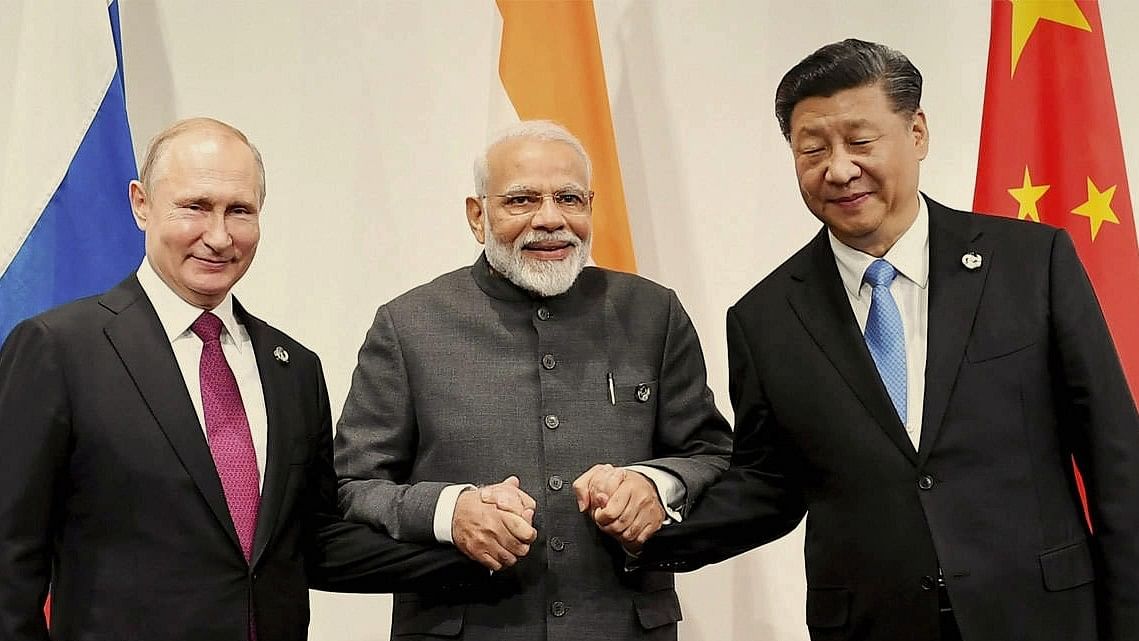 <div class="paragraphs"><p>Putin, Modi, and Xi pose for a picture.</p></div>