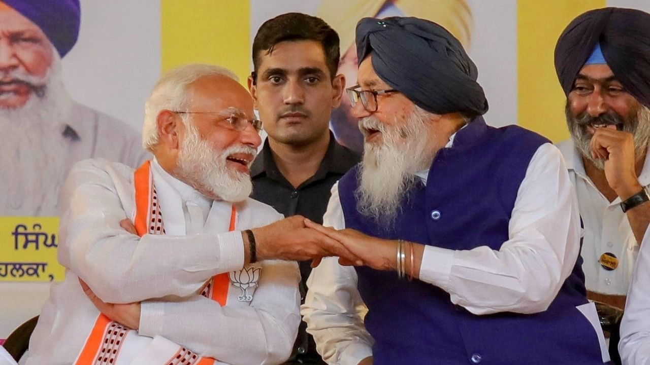 <div class="paragraphs"><p>PM Narendra Modi shares a light moment with SAD leader Parkash Singh Badal,&nbsp;in May 2019.</p></div>
