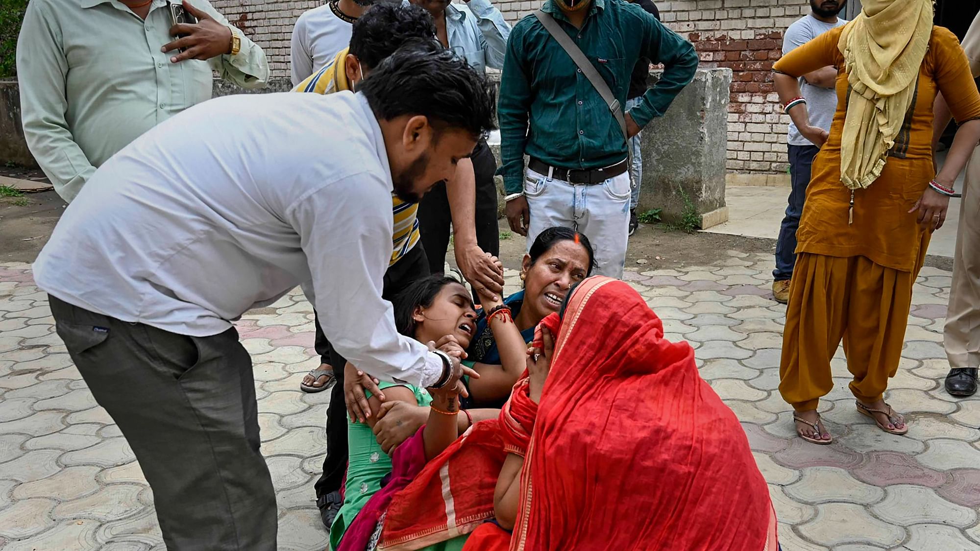 <div class="paragraphs"><p>Ludhiana: Family members of a victim who died after inhaling toxic gas, mourn, at the Giaspura area in Ludhiana district, Sunday, April 30, 2023. </p></div>