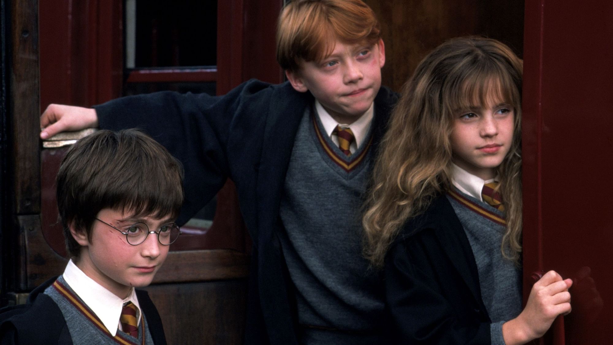 <div class="paragraphs"><p>Daniel Radcliffe, Rupert Grint, and Emma Watson in a still from<em> Harry Potter.</em></p></div>