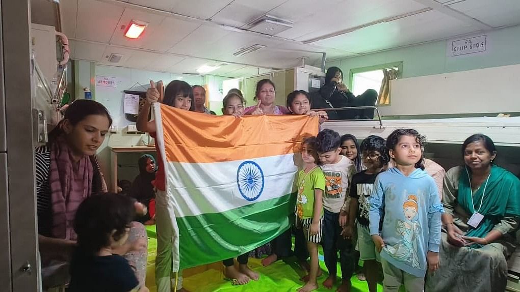 <div class="paragraphs"><p>Indians rescued from Sudan posing for a photograph aboard INS Sumedha on Tuesday, 25 April.&nbsp;</p></div>