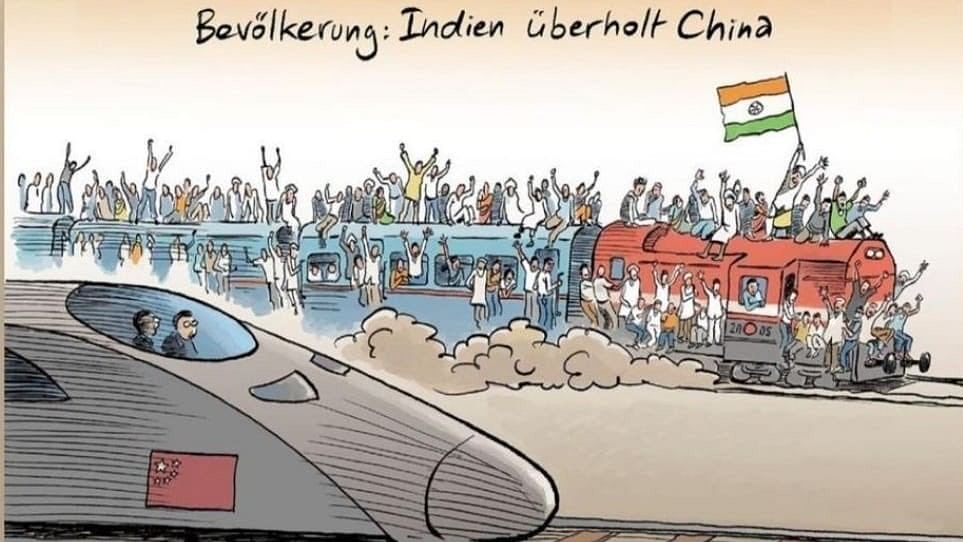 <div class="paragraphs"><p>The cartoon, published in German magazine&nbsp;<em>Der Spiegel</em>,<em>&nbsp;</em>shows an overcrowded train with people sitting on top holding the tricolour and a Chinese bullet train on a parallel track.&nbsp;</p></div>