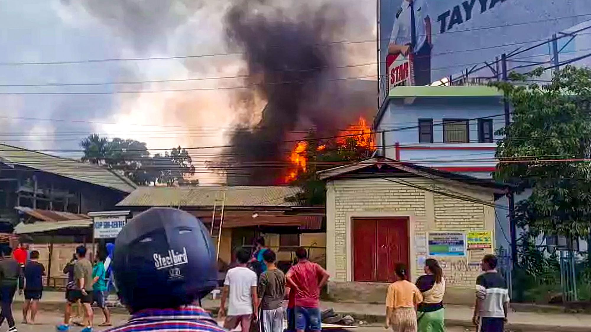 <div class="paragraphs"><p>People near the site of a fire after violence broke out during the Tribal Solidarity March called by the All Tribal Student Union Manipur (ATSUM), in Imphal, on 4 May.</p></div>