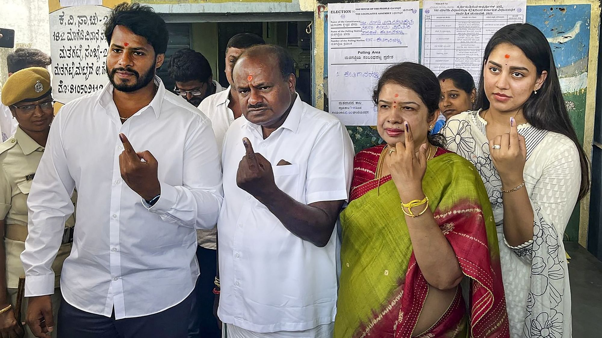 <div class="paragraphs"><p>Former Karnataka CM HD Kumaraswamy with his family members after casting vote for Karnataka Assembly elections, at a polling station, at Bidadi in Ramanagara district, on Wednesday, 10 May.</p></div>
