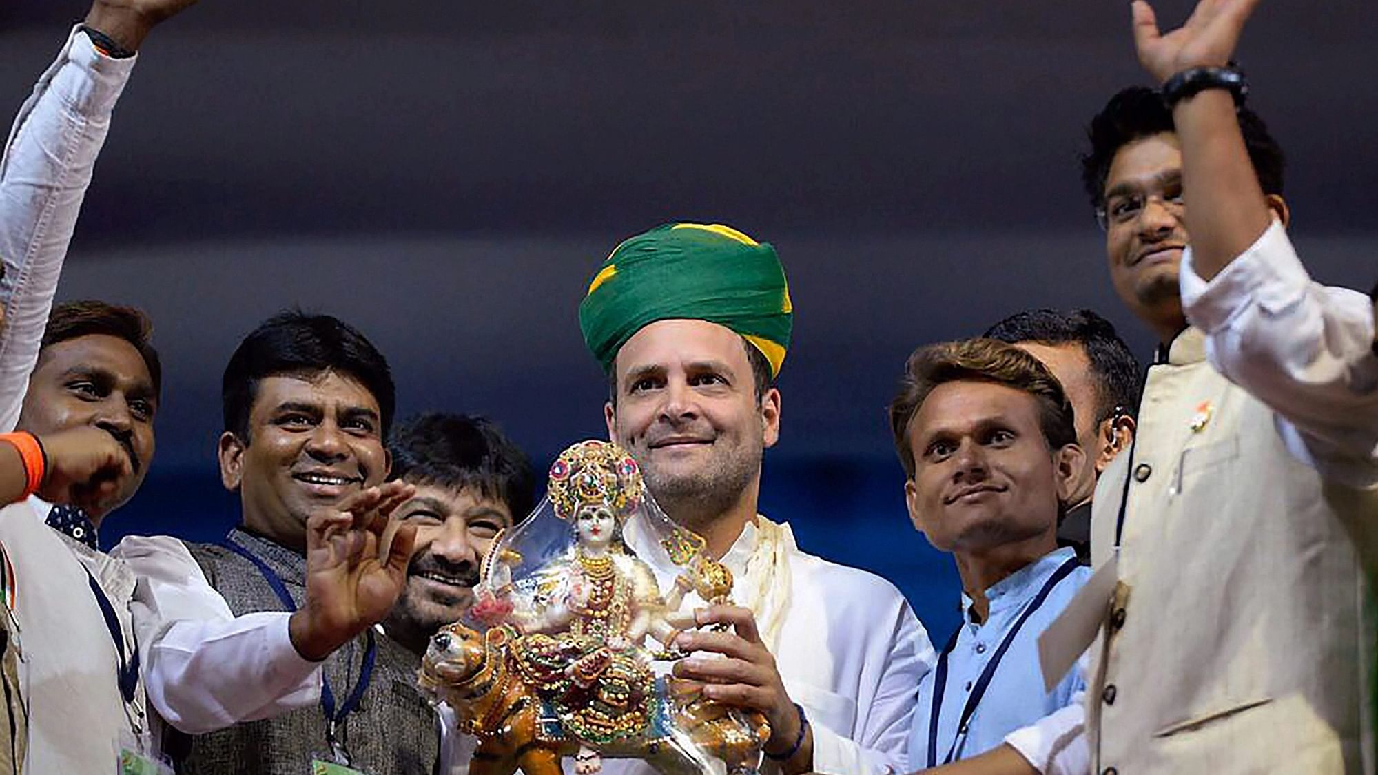 <div class="paragraphs"><p>File Photo: Rahul Gandhi holds a memento of Hindu Goddess Durga presented to him during an election campaign rally in Gandhinagar</p></div>