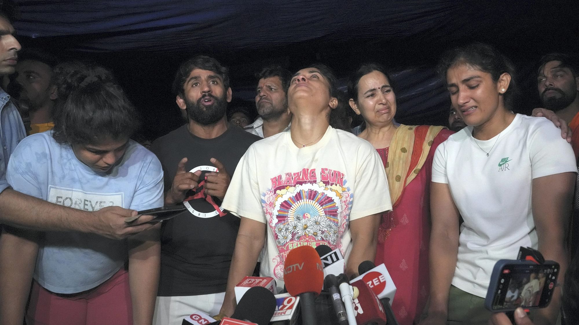 <div class="paragraphs"><p>Wrestlers speak with the media after a scuffle between wrestlers and the police at Jantar Mantar, in New Delhi, Wednesday, May 3, 2023.</p></div>