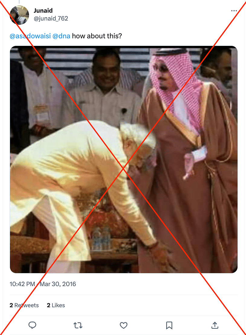 The photo is edited. The original one shows PM Modi bending to touch veteran politician LK Advani's feet.