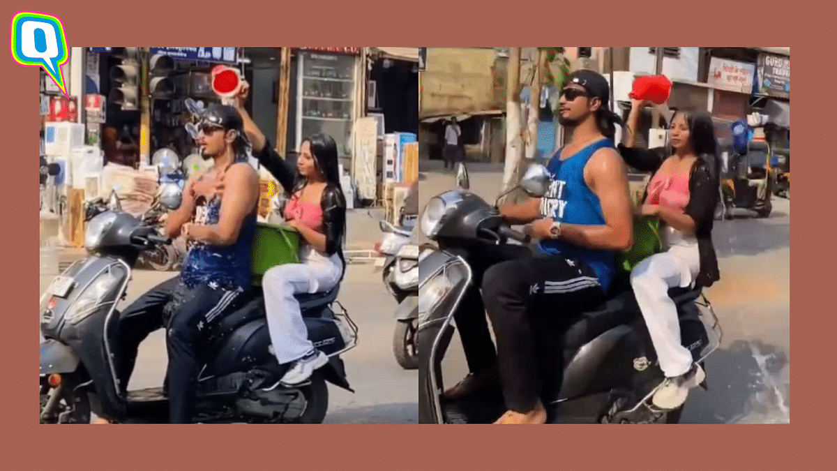 Thane Police Reacts To Video Of Duo Taking A Bath While Riding Scooter 