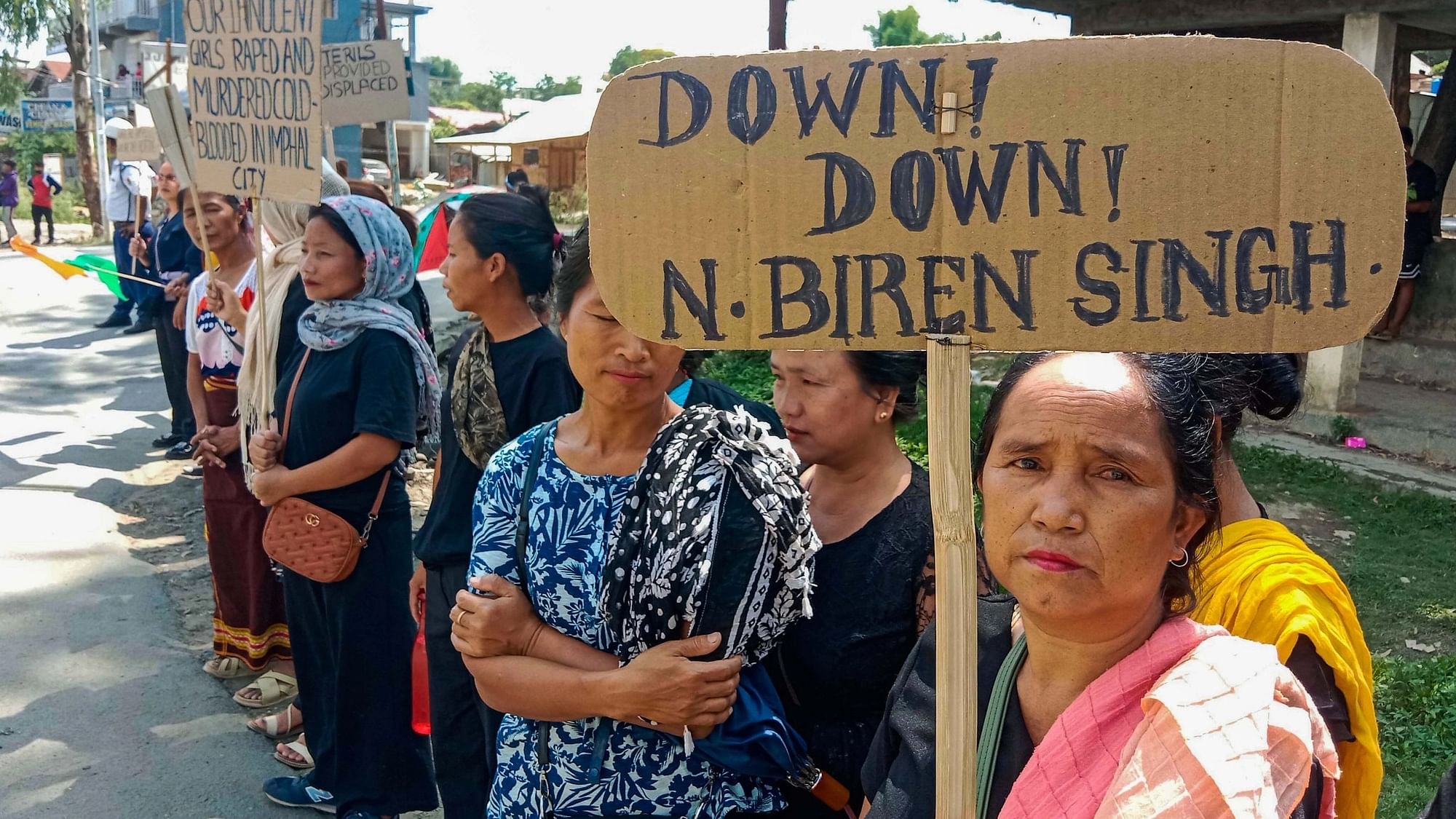 <div class="paragraphs"><p>Kuki tribals holding a placard take part in a rally  at Churachandpur in Manipur.&nbsp;</p></div>