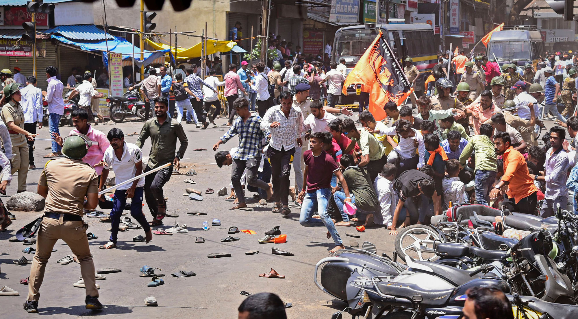 <div class="paragraphs"><p>Security personnel disperse people protesting on Wednesday in Kolhapur.</p></div>