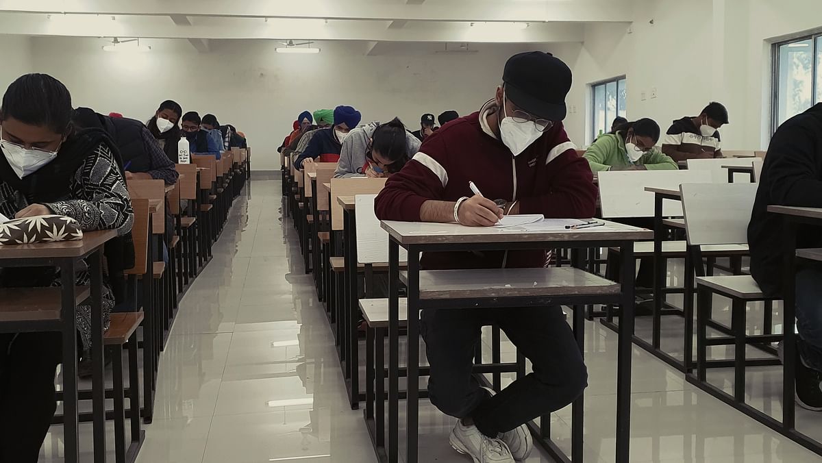 Tracing the Duality of Caste in Competitive Exams via Experimental Evidence