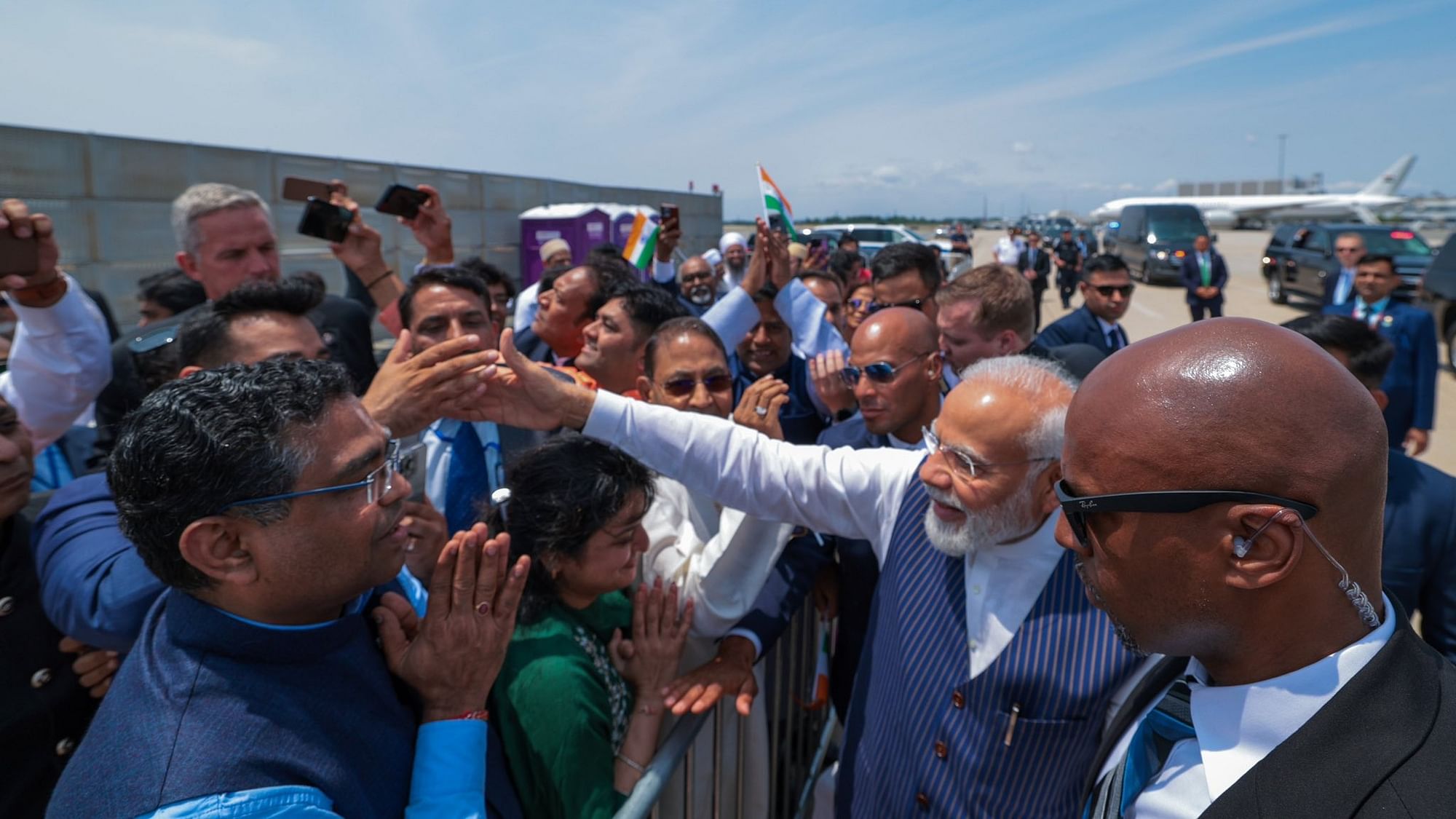 <div class="paragraphs"><p>Visuals from the ground showed the Indian PM exiting his aircraft, waving to the crowd and being received by a delegation of US officials. </p></div>