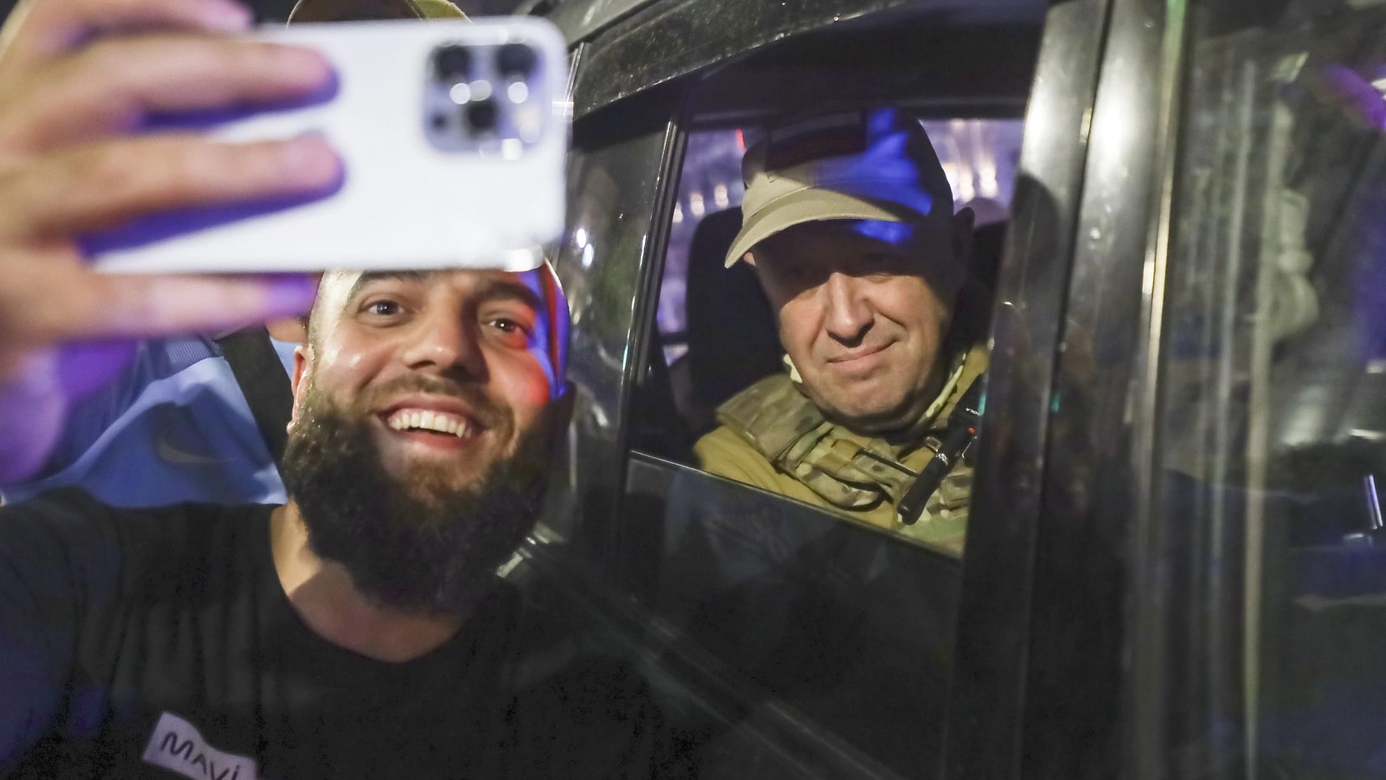 <div class="paragraphs"><p>Yevgeny Prigozhin, the owner of the Wagner Group military company, right, sits inside a military vehicle posing for a selfie photo with a local civilian on a street in Rostov-on-Don, Russia, Saturday, June 24, 2023, prior to leaving an area of the headquarters of the Southern Military District. </p></div>