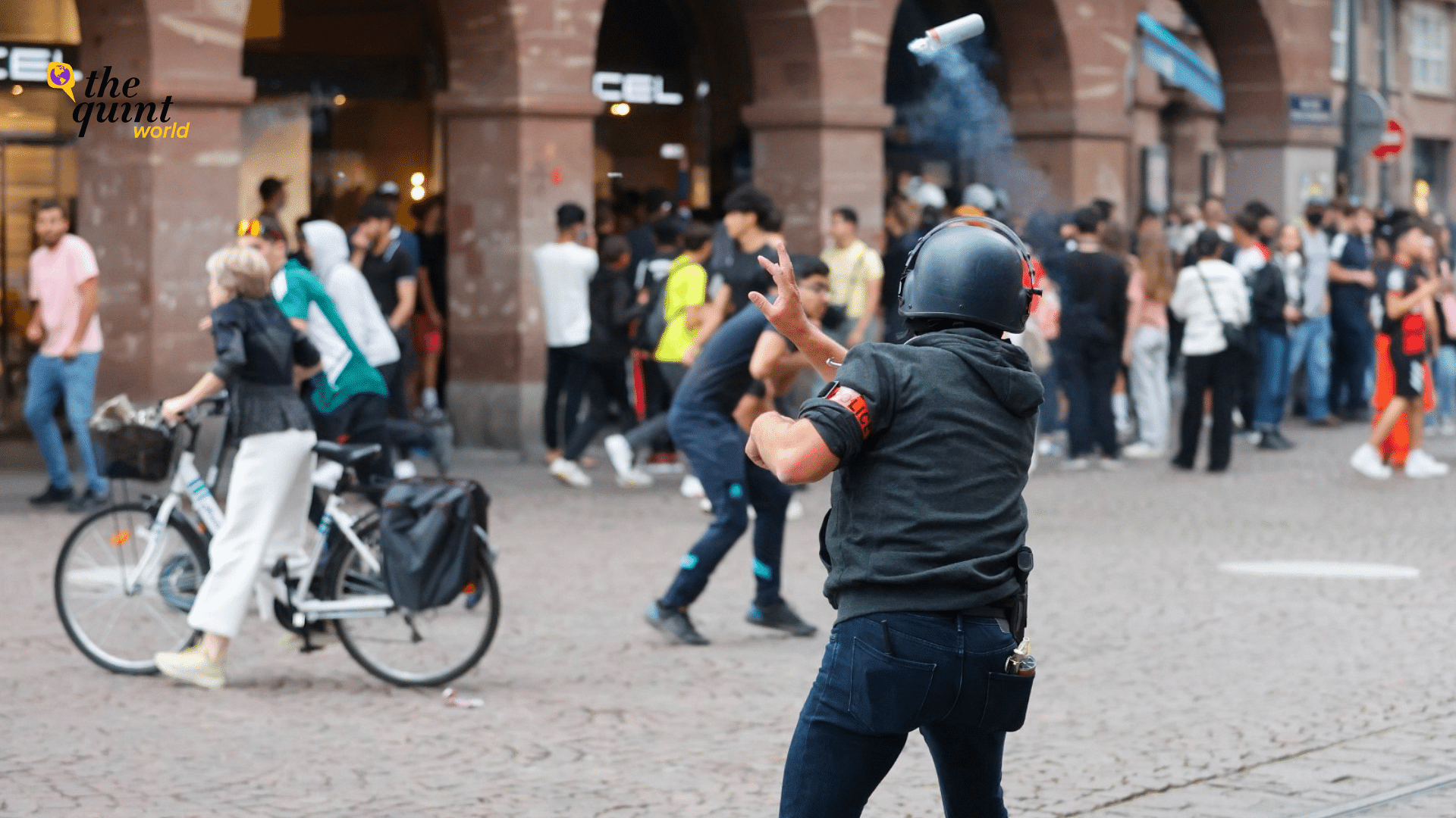 <div class="paragraphs"><p>A police officer throws a tear gas canister to youths Friday, 30 June 2023, in Strasbourg, eastern France.</p></div>