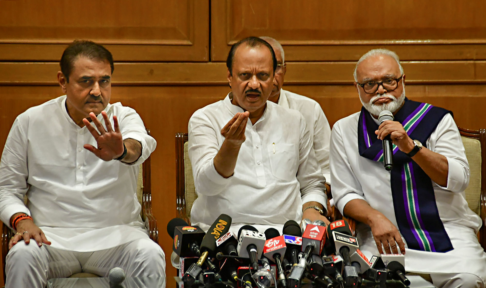 <div class="paragraphs"><p>Newly sworn-in Maharashtra Deputy Chief Minister Ajit Pawar with Nationalist Congress Party (NCP) leaders Chhagan Bhujbal and Praful Patel during a press conference, in Mumbai, Sunday, July 2, 2023.</p></div>