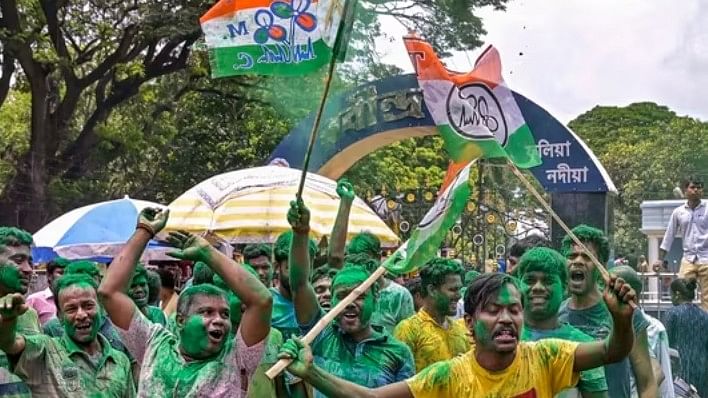 <div class="paragraphs"><p>TMC workers and supporters celebrate the party's lead during the counting of votes of the West Bengal panchayat polls, in Nadia district on Tuesday.</p></div>