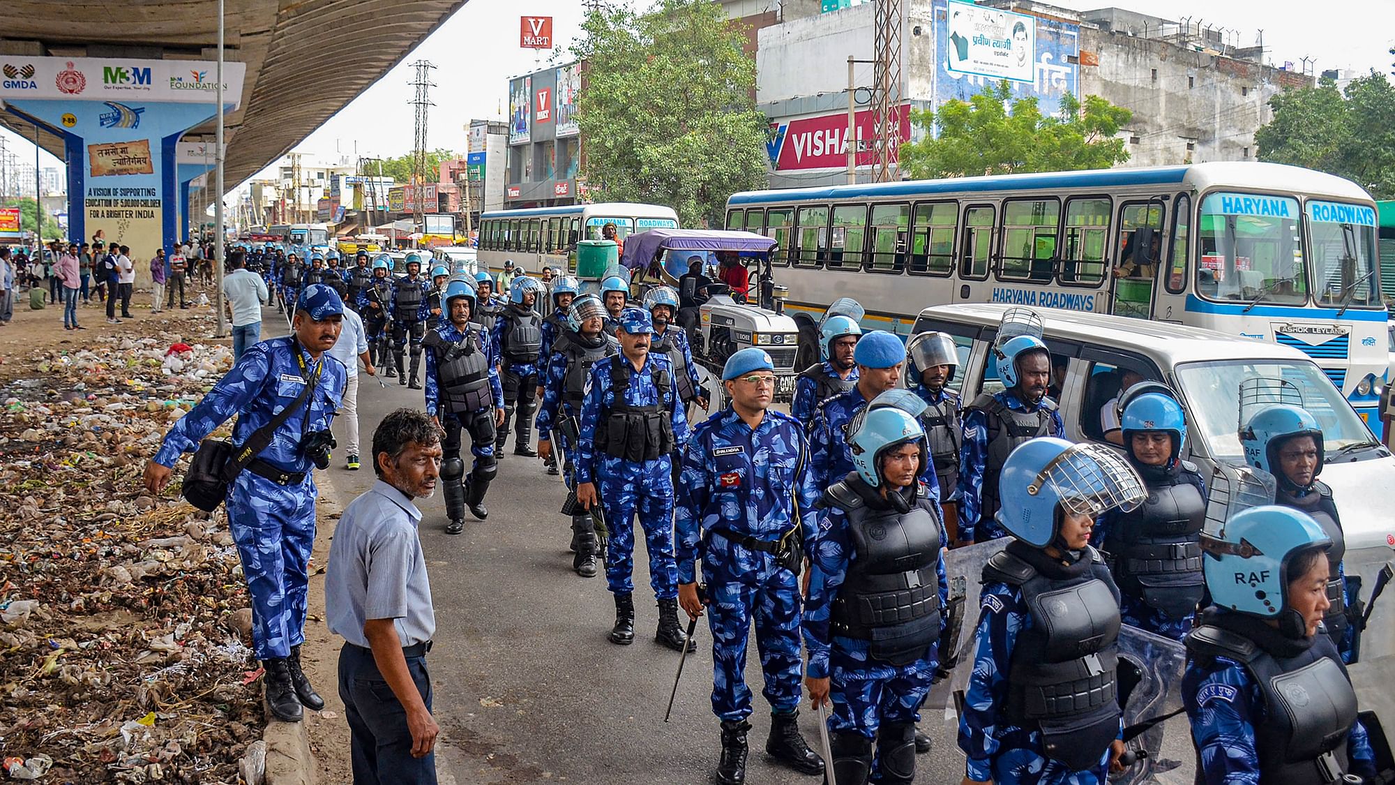 <div class="paragraphs"><p>Rapid Action Force (RAF) personnel conduct a flag march at Badshahpur after incidents of violence in the adjoining Nuh district.</p></div>