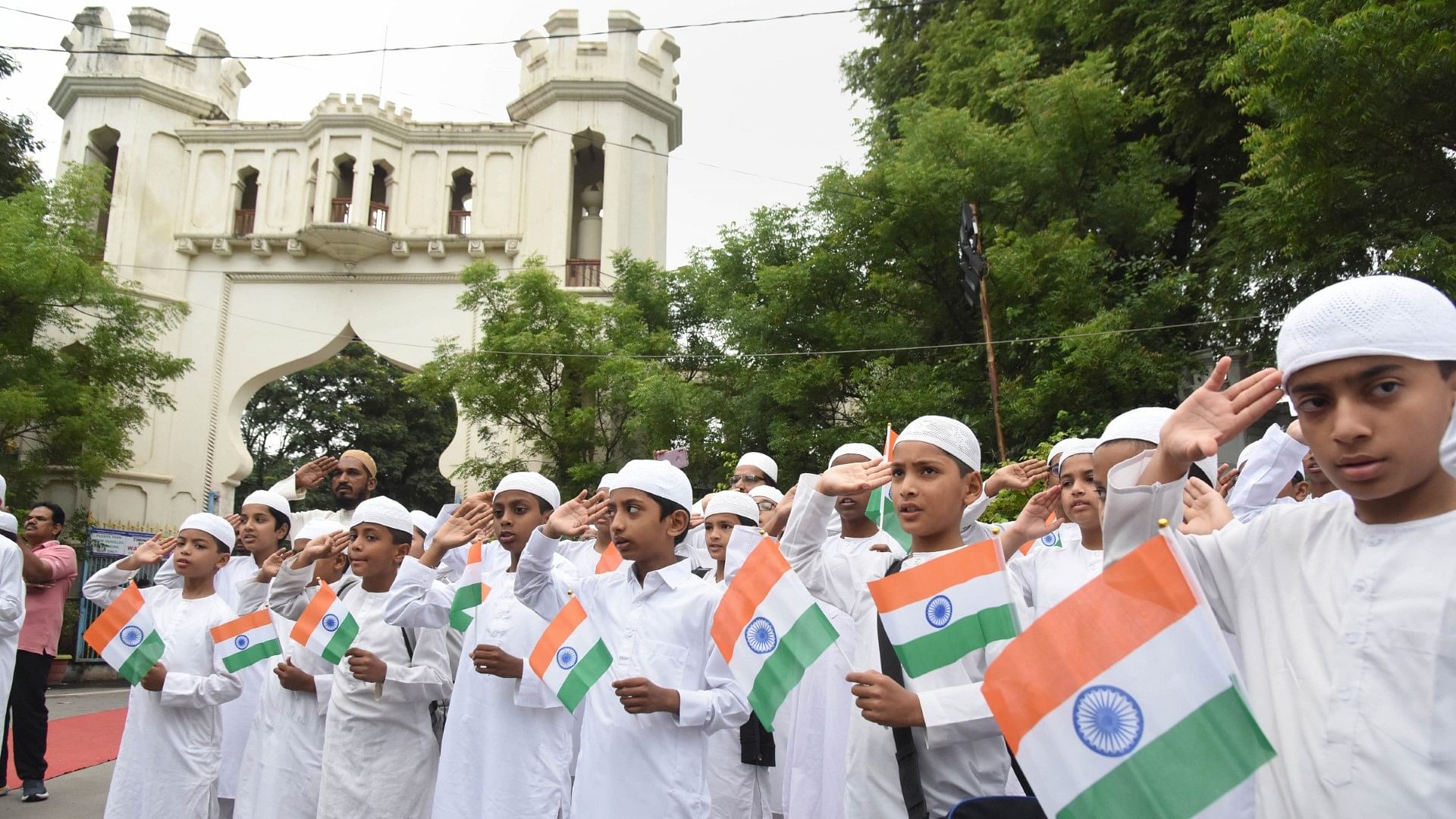 <div class="paragraphs"><p>The students of Madrasa Alhamoomi Litahfeez Al Quraan celebrate the 77th Independence Day at Shahi Masjid Public Garden in Hyderabad on Tuesday, 15 August.</p></div>