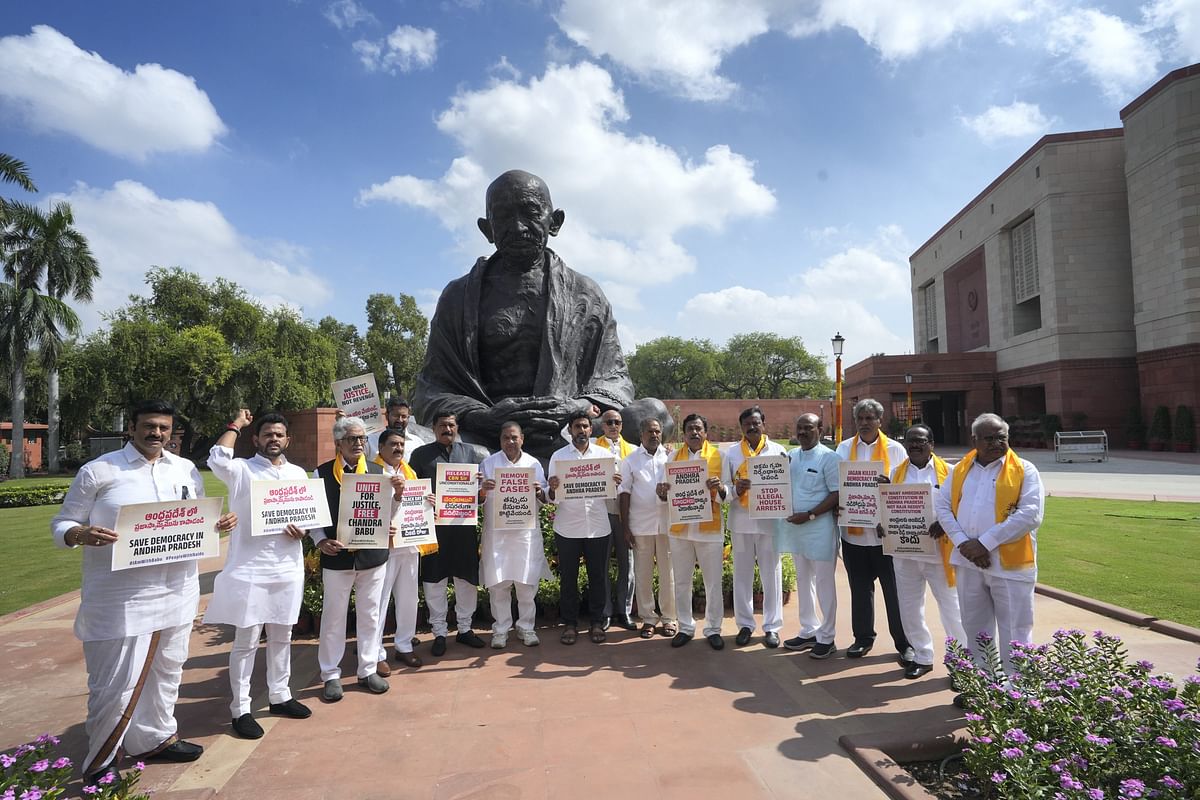 <div class="paragraphs"><p>Telugu Desam Party (TDP) MPs with former Andhra Pradesh CM N Chandrababu Naidu's son Nara Lokesh stage a protest at Mahatma Gandhi statue over Naidu's arrest on the first day of the Special session of Parliament, in New Delhi, Monday, 18 September, 2023. </p></div>