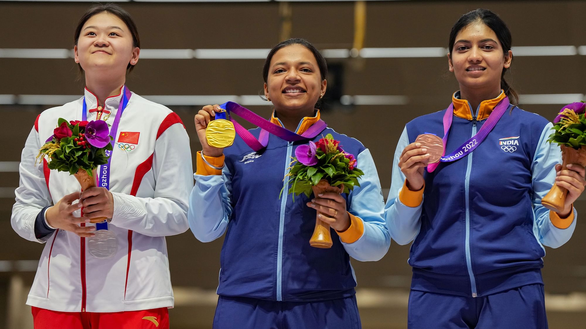 <div class="paragraphs"><p>Gold medallist Indian shooter Sift Kaur Samra, bronze medallist compatriot Ashi Chouksey and silver medalist China's Qiongyue Zhang pose for photos during the presentation ceremony of the women's 50m rifle 3 positions event at the 19th Asian Games, in Hangzhou, China, Wednesday, Sept. 27, 2023.</p></div>