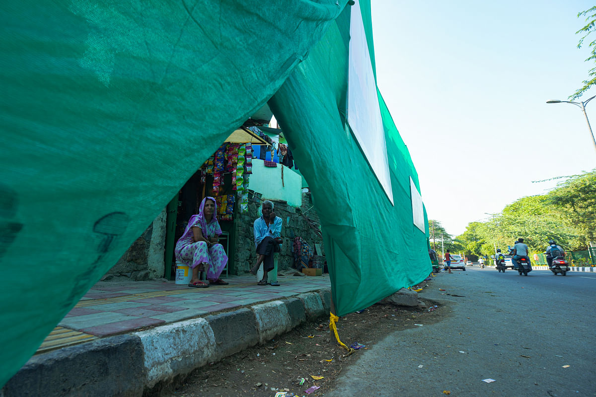 With Delhi's beautification drive ahead of G20 Summit in full swing, slums are being hidden behind green sheets.
