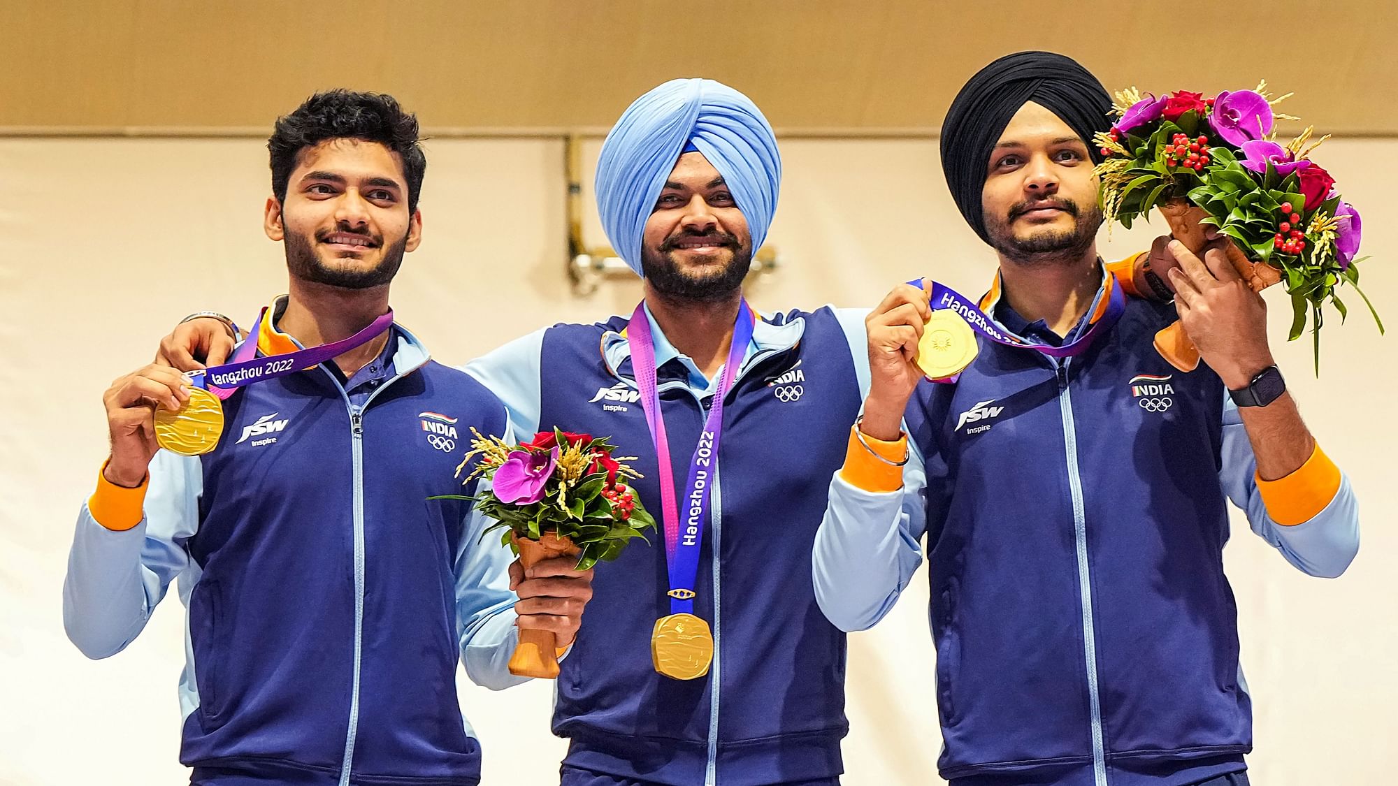<div class="paragraphs"><p>Hangzhou: Gold medal winning Indian team shooters Sarabjot Singh, Arjun Singh Cheema and Shiva Narwal pose for photographs during presentation ceremony of the men's 10m air pistol event at the 19th Asian Games, in Hangzhou, China, Thursday, Sept. 28, 2023.</p></div>