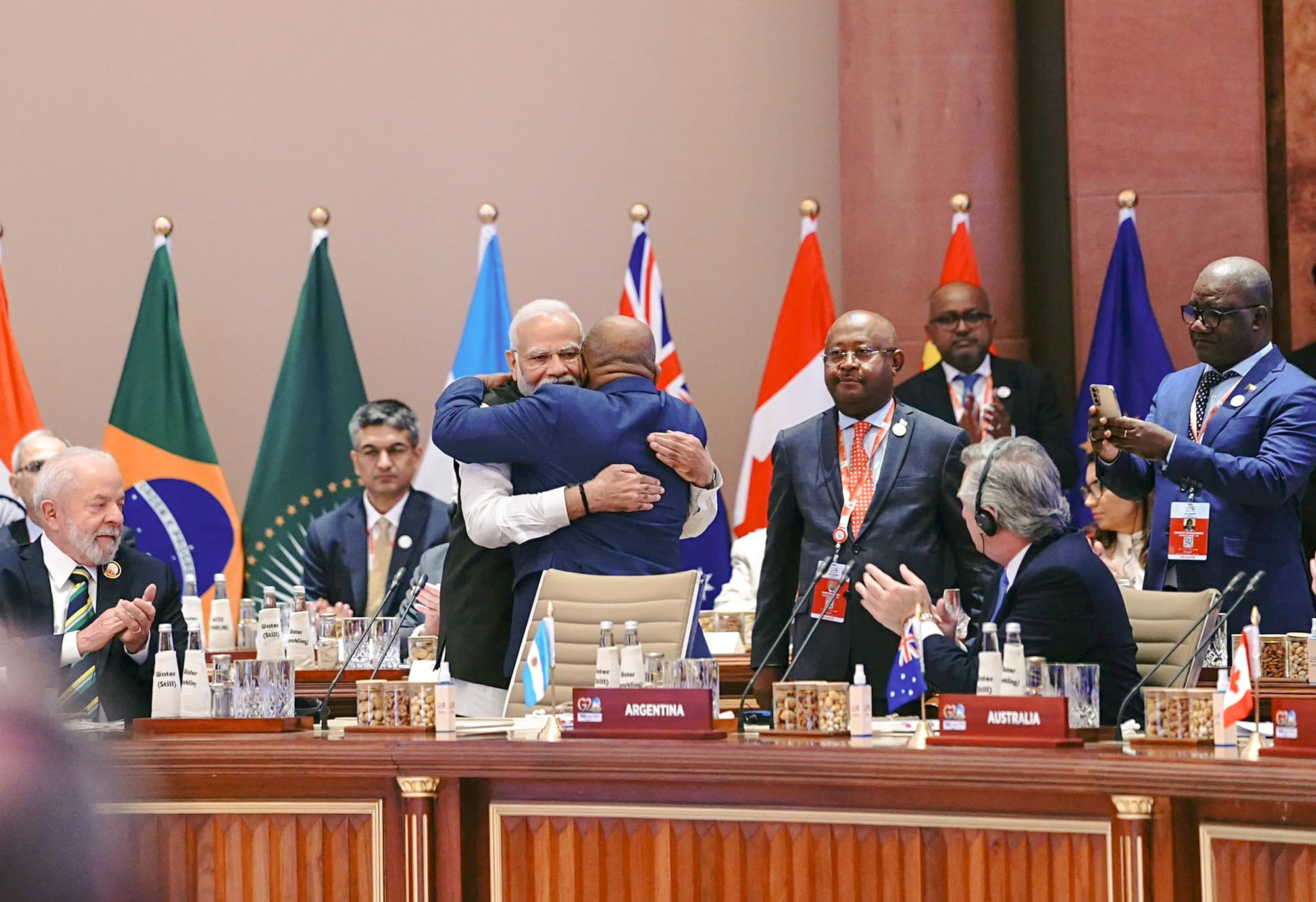 <div class="paragraphs"><p>New Delhi: Prime Minister Narendra Modi hugs President of the Union of the Comoros and Chairperson of the African Union (AU) Azali Assoumani as the latter takes his seat after the Union became a permanent member of the G20 during the G20 Summit 2023 at the Bharat Mandapam.</p></div>