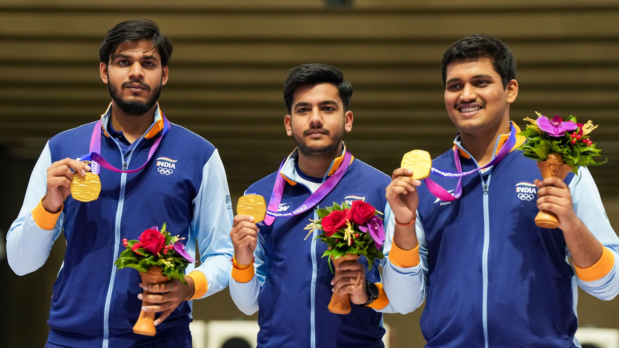 <div class="paragraphs"><p>Indian shooters Rudrankksh Patil (R) and Aishwary Pratap Singh Tomar (2nd R) and Divyansh Singh Panwar after winning a gold in men's 10m Air Rifle event at the 19th Asian Games, in Hangzhou, China, Monday, Sept. 25, 2023. </p></div>