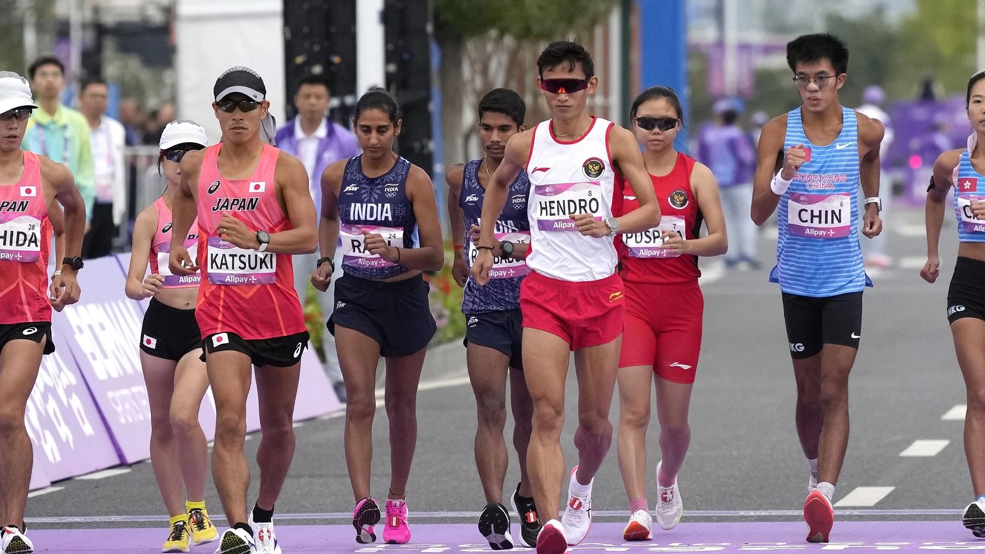 <div class="paragraphs"><p>Manju Rani and Ram Baboo during the 35km Race Walk Mixed Team event at the 19th Asian Games.</p></div>