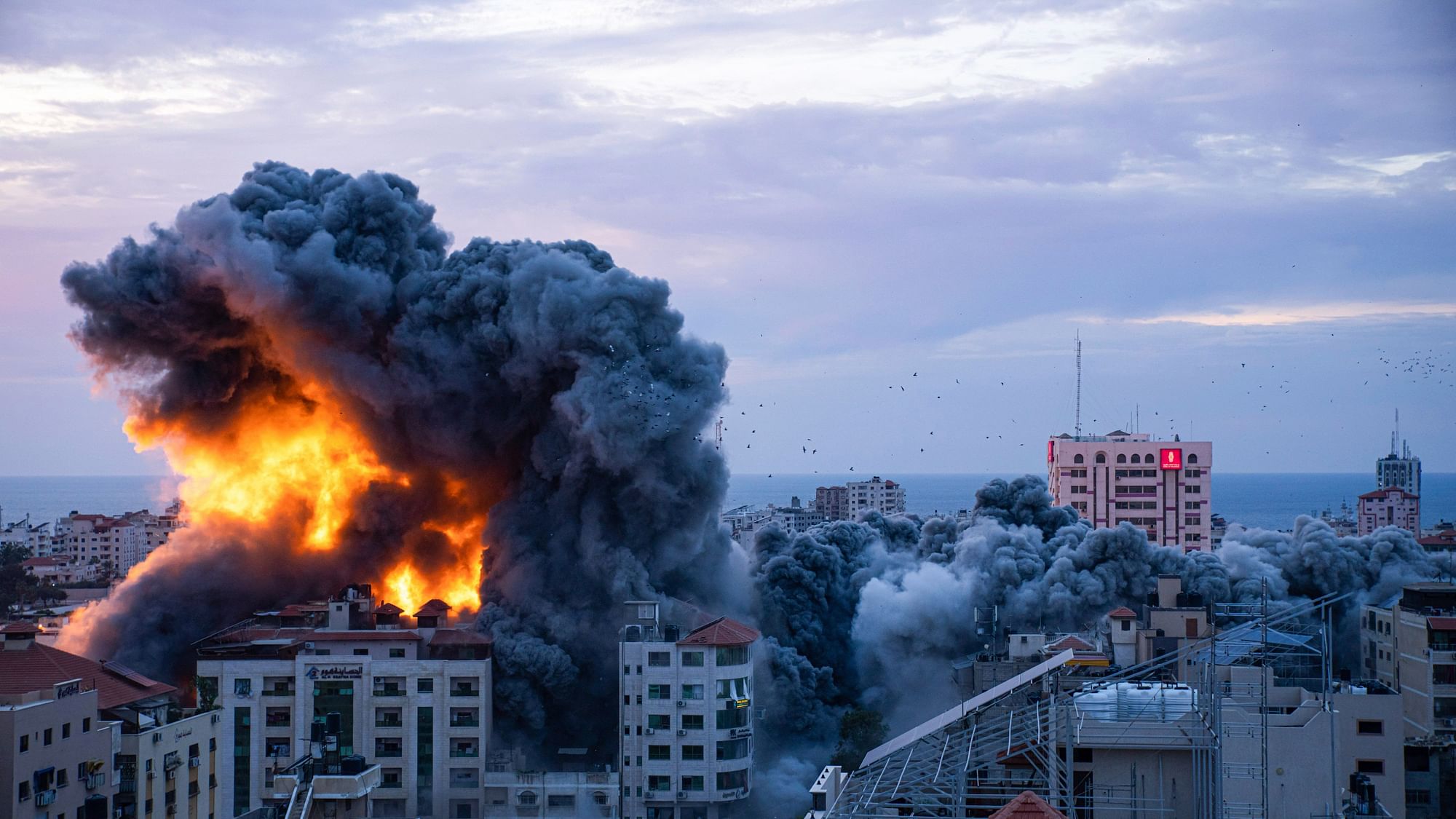 <div class="paragraphs"><p>Fire and smoke rises following an Israeli airstrike, in Gaza City on 7 October.</p></div>