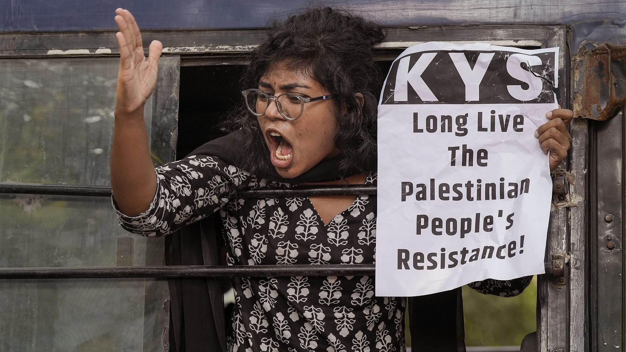 <div class="paragraphs"><p>A detained CPI (ML) worker shout slogans during a protest in support of Palestine, at Jantar Mantar, New Delhi, on Monday, 16 October. </p></div>