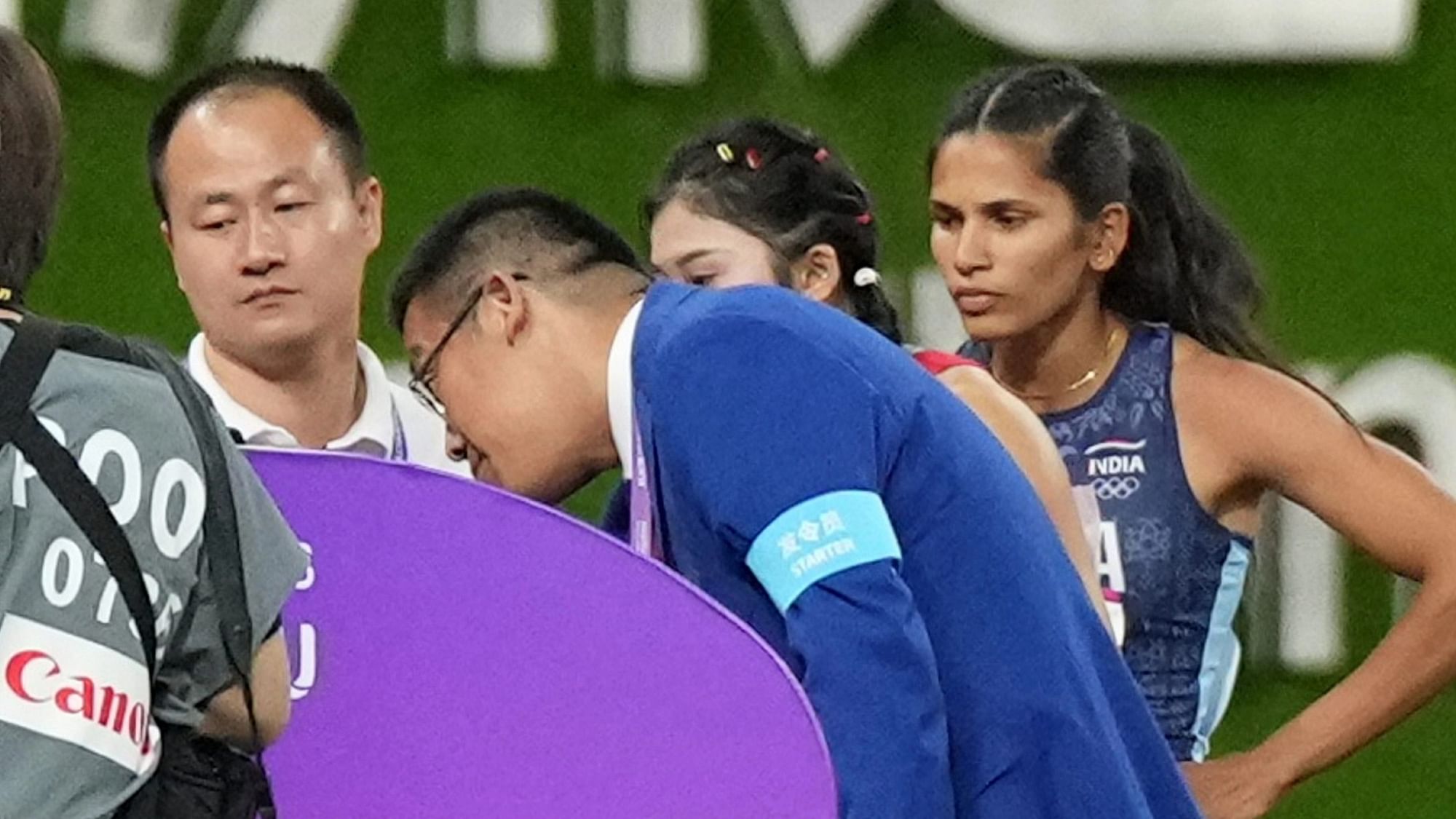 <div class="paragraphs"><p>Hangzhou: India's Jyothi Yarraji and China's Wu Yanni talk to technical officials during the women's 100-meter hurdle final at the 19th Asian Games in Hangzhou, China, Sunday, Oct. 1, 2023. </p></div>