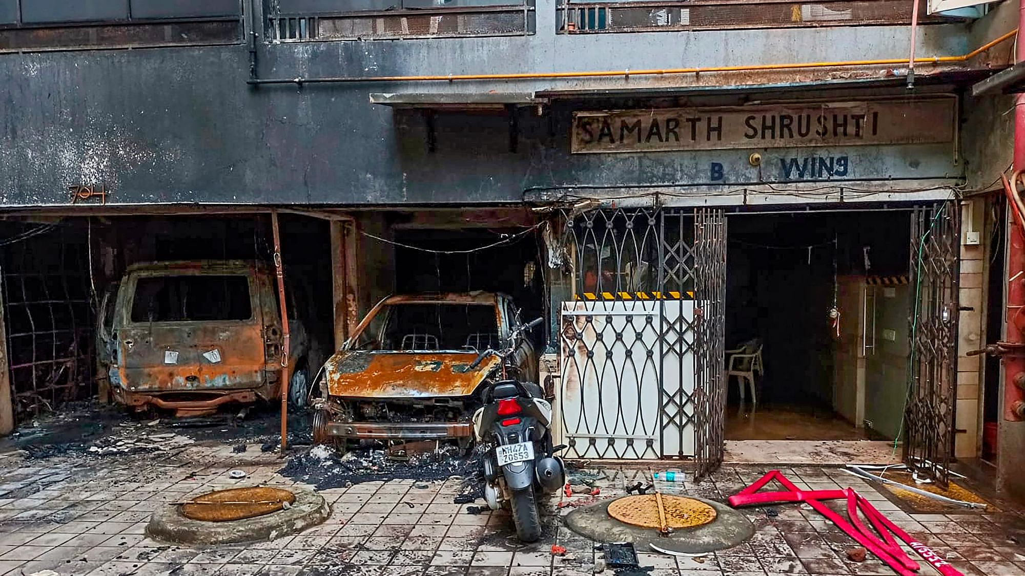 <div class="paragraphs"><p>Charred vehicles after a fire broke out in a multi-storey residential building in Goregaon area Mumbai, early on Friday, 6 October.</p></div>